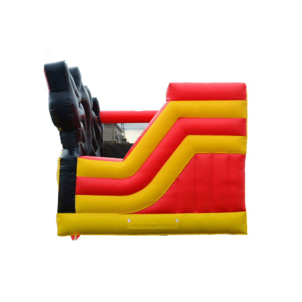 Children playing inside Mickey Mouse inflatable bounce house at outdoor party
