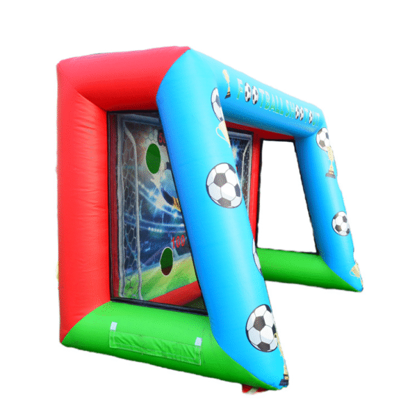 Children playing field goal game using inflatable goal post at outdoor event