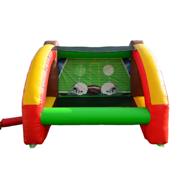 Children playing on two-sided football inflatable game at an event