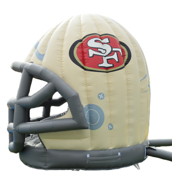 Children playing inside a 49ers bounce house with vibrant red and gold football theme